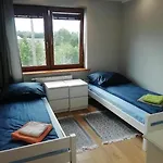 Mragowo Pokoje Apartament ゲストハウス